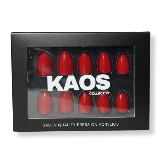 Box of red press-on acrylic nails with 'KAOS Collective' branding on a white background
