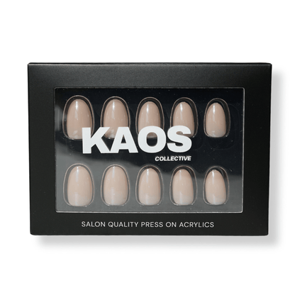 Box of press-on acrylic nails by KAOS Collective on a white background