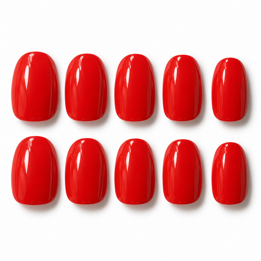 Ten glossy red artificial nail tips arranged in two rows of five on a plain white background.