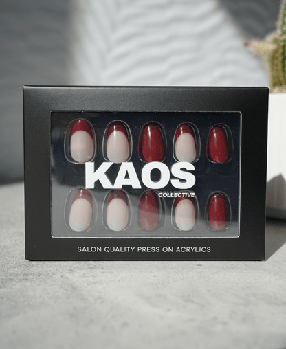 Box of 'KAOS Collective' press-on acrylic nails on a neutral background
