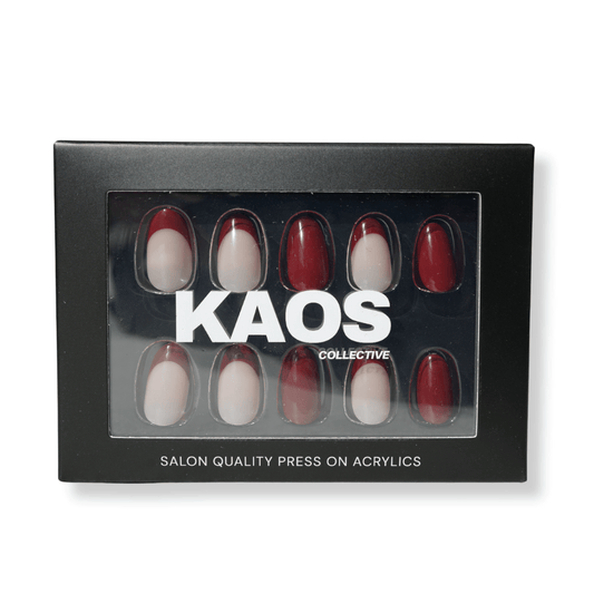 Box of press-on acrylic nails with red and white designs, branded 'KAOS Collective'.