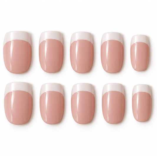 Ten press-on nails arranged in two rows of five on a plain white background. Each nail has a glossy nude-pink lower section and a white tip, resembling a classic French manicure.