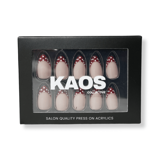 Box of press-on acrylic nails with 'KAOS Collective' branding on a white background