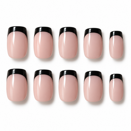 Ten false press-on nails arranged in two rows on a white background, featuring a glossy pale pink base with a bold black French tip.