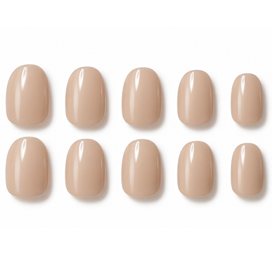 Ten nude beige press-on nails arranged in two rows of five on a clean white background.